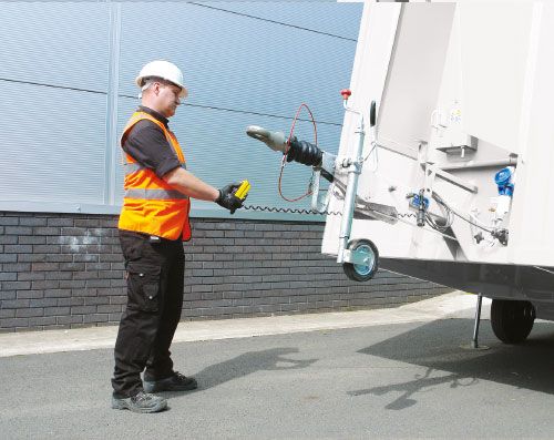 Unhitch from towing vehicle and operate hydraulics using the push button controls